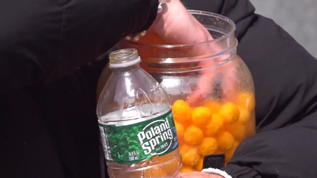 “Eat Those Balls!” Hundreds Flock to Watch Man Eat Tub of Cheese Balls at Union Square Park - NYC